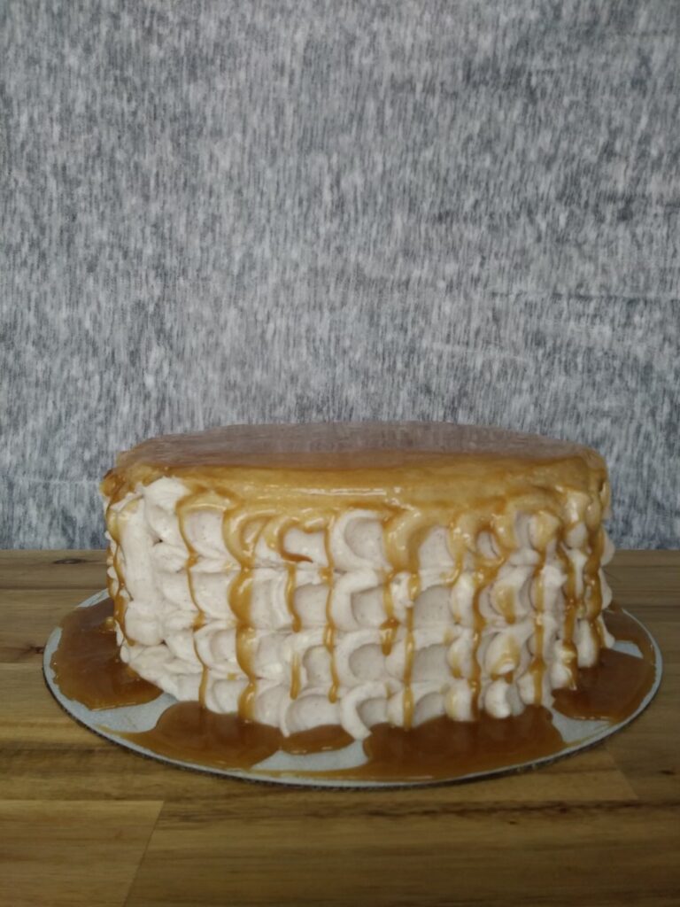 Spice cake with cinnamon buttercream and caramel drizzle.