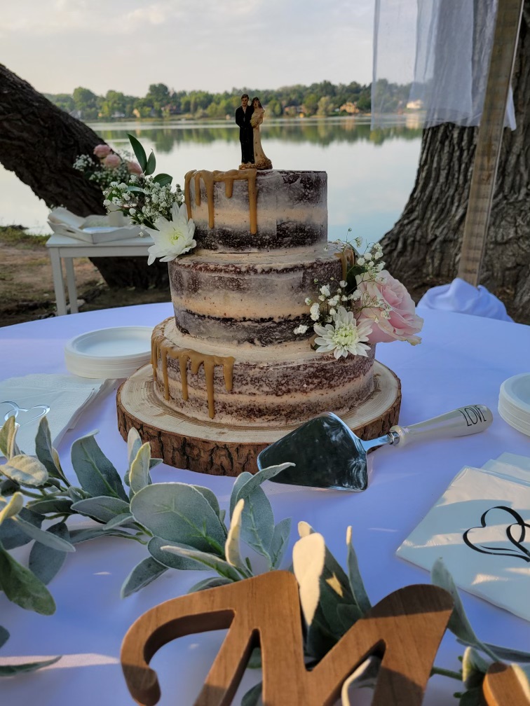 three tier naked spice cake with caramel drizzle 